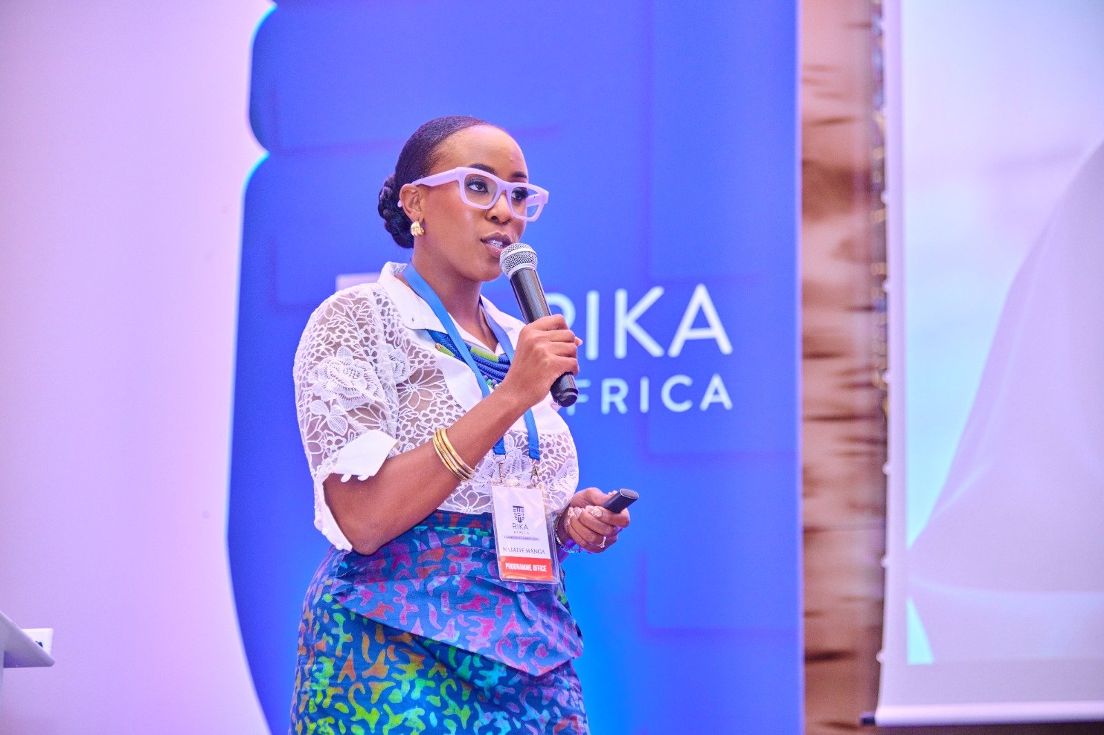 Natalie Manga speaking on stage at RIKA Africa